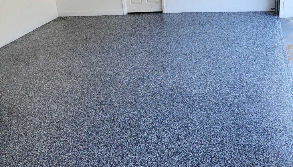 Blue and white vinyl flaked epoxy garage floor.