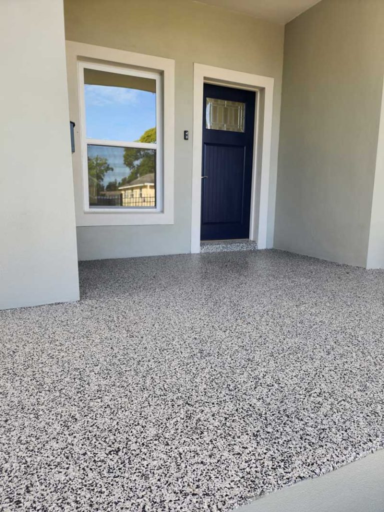 Black and white vinyl flaked epoxy patio.